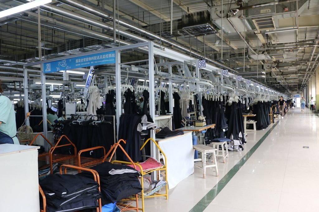 Hanger System for Outerwear & Suits — CleverMax hanger system on the production floor
